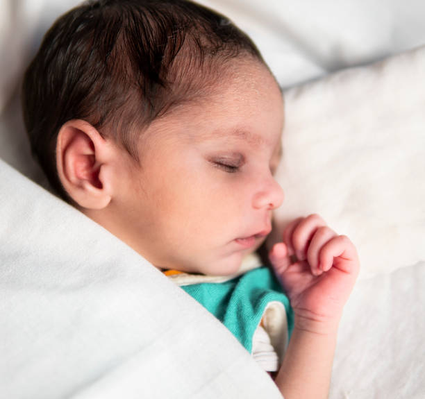 istock Cute peacefully newborn baby sleeping. 1346197889