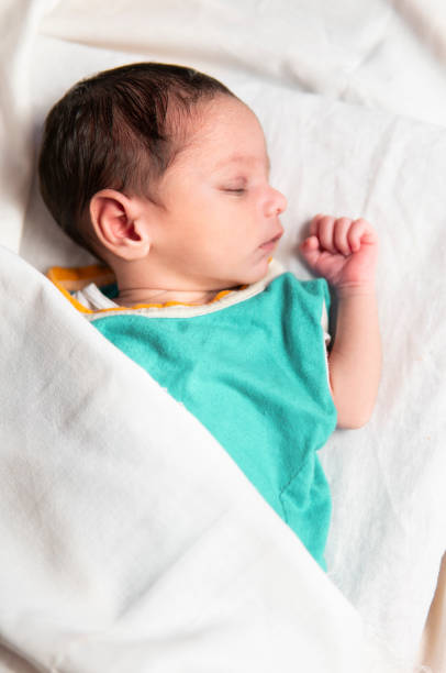 istock Cute peacefully newborn baby sleeping. 1346198429