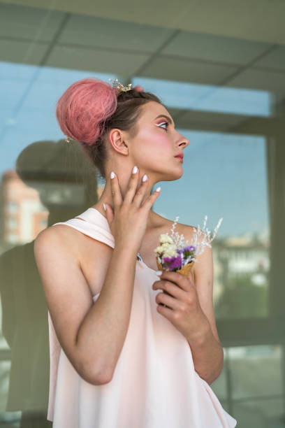 istock attractive woman posing with hands near face 1346200588