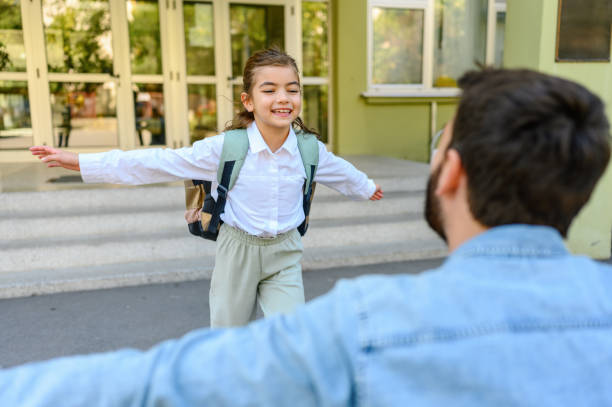 istock Daughter running into father's arms 1346200628