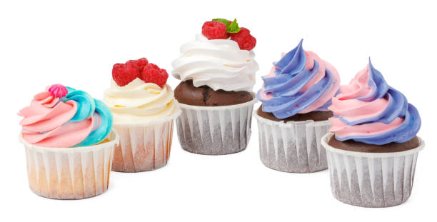istock Group of cupcakes with colored topping isolated on white background 1346201339
