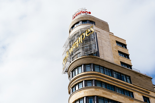 Madrid, Spain - October 10, 2021: Iconic Capitol Building in Callao Square in Gran Via. Close-Up view of the facade