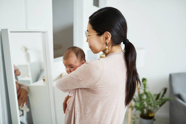 istock Woman with child standing in the room 1346203490