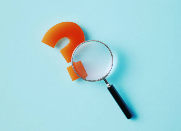 istock Magnifier And Question Mark Sitting On Aquamarine Background 1346203691