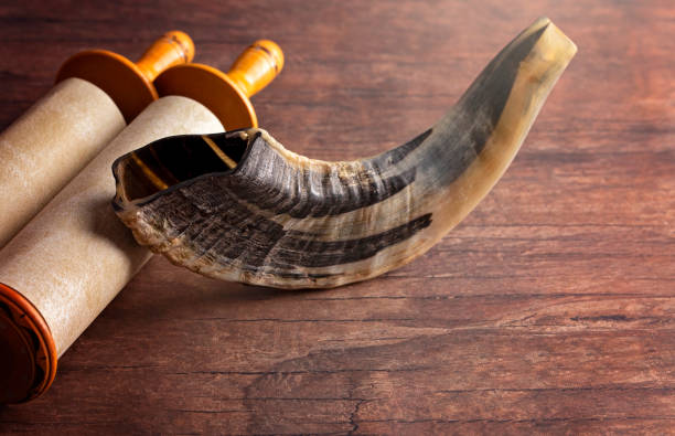 istock A Shofar Rams Horn and a Tora Scroll on a Wooden Table 1346203758
