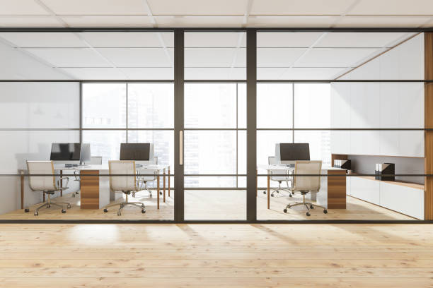 istock Framed glass door of stylish white panoramic office 1346204727