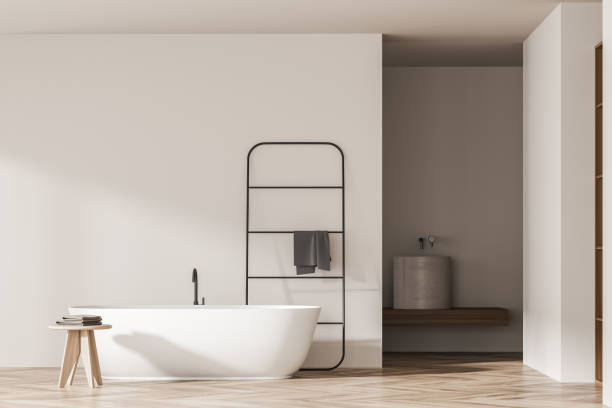 istock Bright bathroom interior with empty wall, bathtub, towel, sink 1346204742