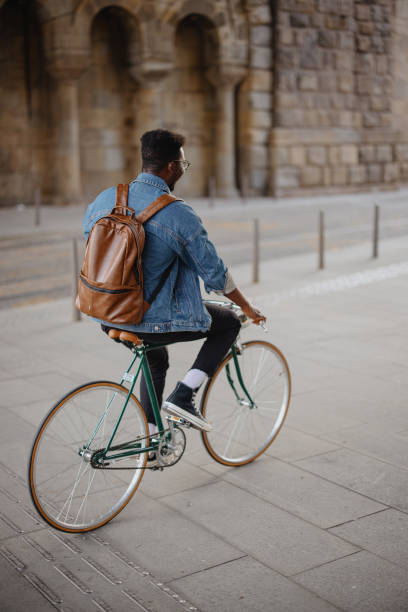 istock A young modern businessman going to work by bike 1346206122