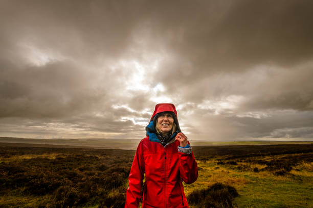 hole of horcum rain hike, yorkshire, england - drenched raincoat rain clothing stock-fotos und bilder