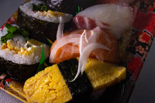 Closeup a pack of Makizushi and Nigiri Sushi sold by local supermarket in Japan Closeup a pack of Makizushi and Nigiri Sushi sold by local supermarket in Japan. Makizushi is a type of sushi where sushi rice and a variety of ingredients such as Tamagoyaki, Kanpyo, Fish etc salmon and red snapper stock pictures, royalty-free photos & images