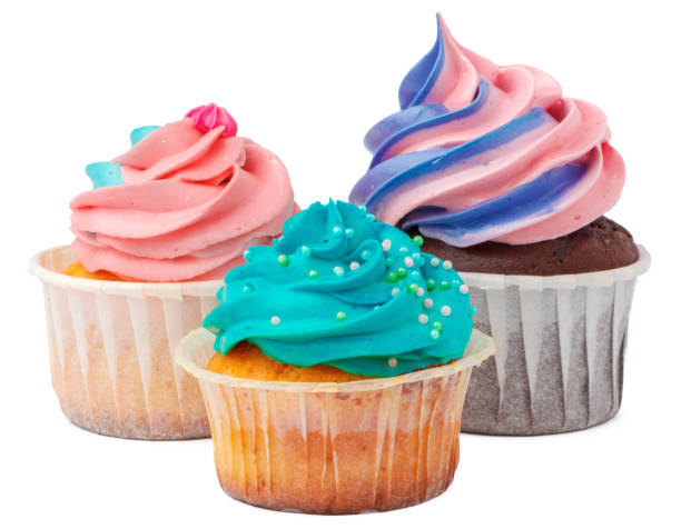 istock Three yummy cupcakes with icing isolated on white background 1346214226