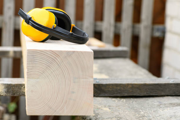 istock Protective earmuffs when working with wood in a sawmill , close up 1346215040