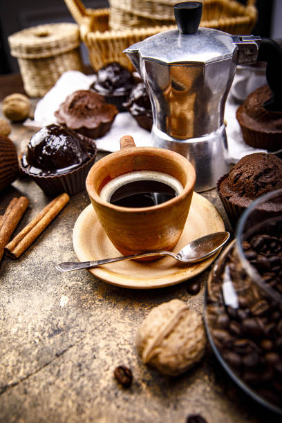 Crafting coffee in clay cup with bean