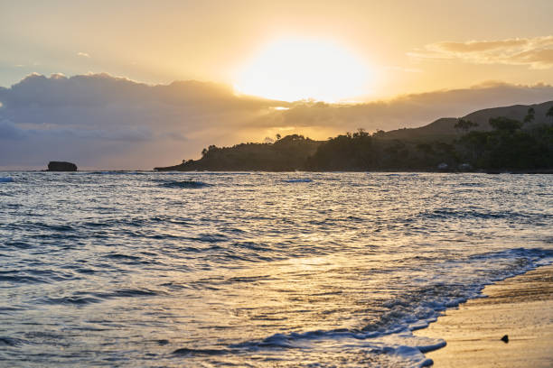 istock Sunrise over a tropical island with a sandy beach. 1346216866