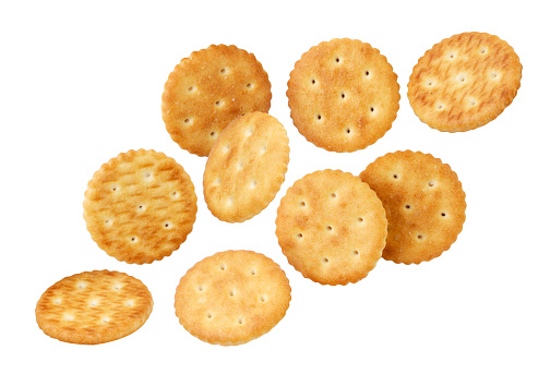 Crackers falling close-up on a white background, cut out. Isolated