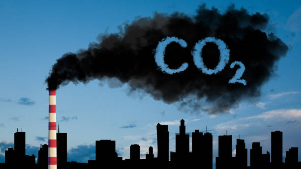 Air pollution from smoke coming out of factory chimneys. CO2 emissions into the atmosphere. stock photo