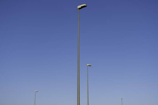 istock Sunset sky with street lamps 1346219738