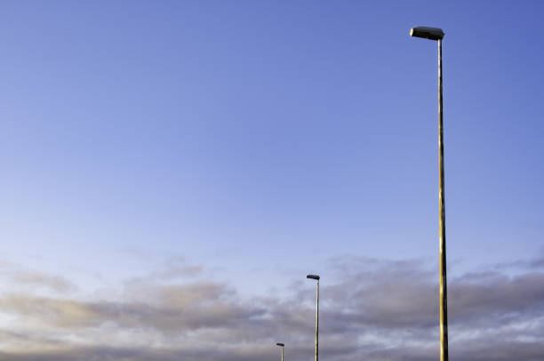 istock Sunset sky with street lamps 1346219740