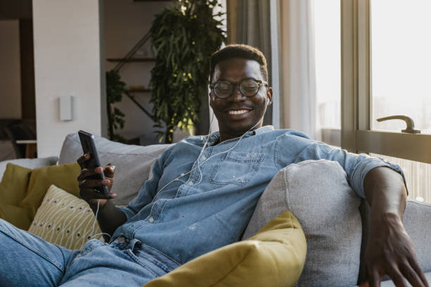 istock Young man enjoying in music at home 1346220337