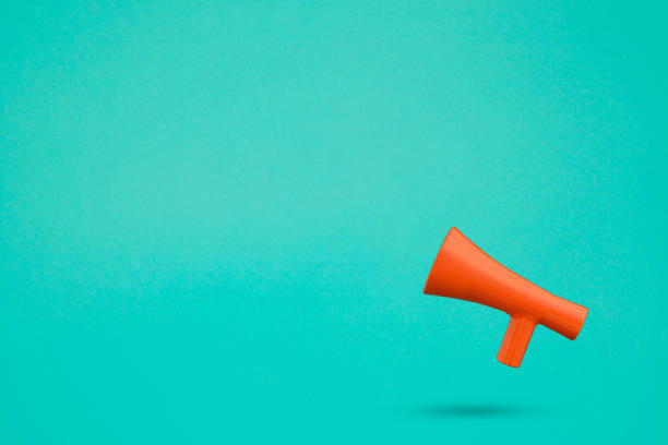 istock Blank copy space with red 3d megaphone icon against turquoise