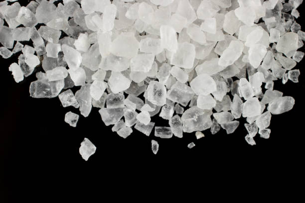istock Sea salt on a black background place for text cope space 1346221483