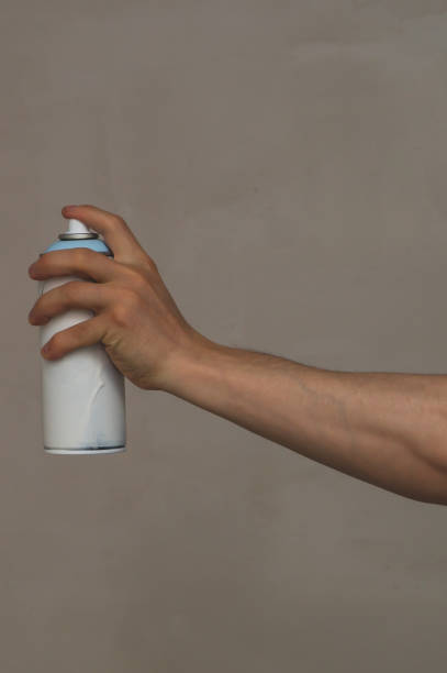 istock Spray can in the hand. painting process 1346222727