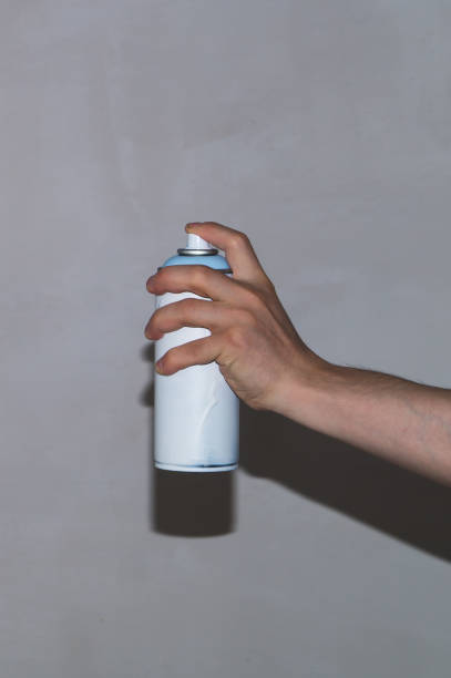 istock Spray can in the hand. painting process 1346222734