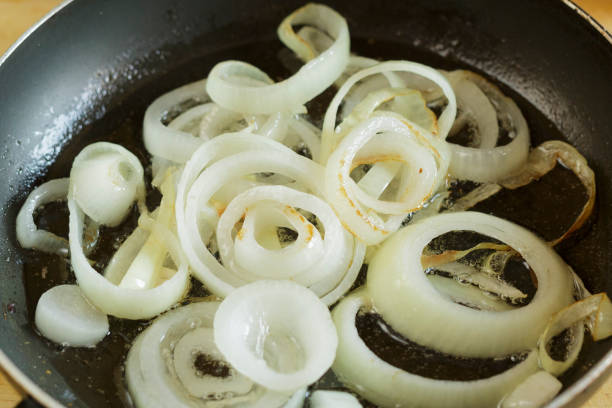Onion poached in the pan, onion in a ring-