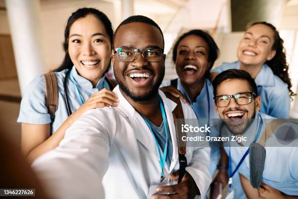 Cheerful Medical Students Taking Selfie And Having Fun At The University Stock Photo - Download Image Now