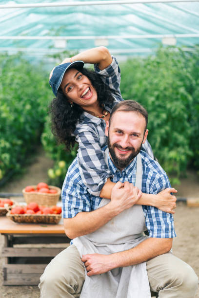istock Couple farmers having fun, embracing 1346228679