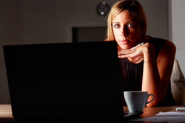 istock Dedicated businesswoman working late into the night 1346228899