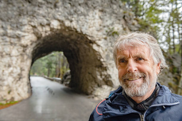 Mature man portrait, walking and watching looking at the forest,, Primorska, Julian Alps, Slovenia, Europe Mature man portrait, walking and watching looking at the forest,, Primorska, Julian Alps, Slovenia, Europe primorska white sport nature stock pictures, royalty-free photos & images