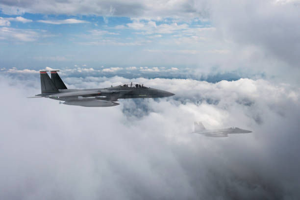 istock Jet aircraft flying over the clouds. 1346233460