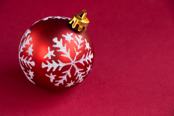 istock red Christmas ball on a deep red background. Christmas background 1346234138