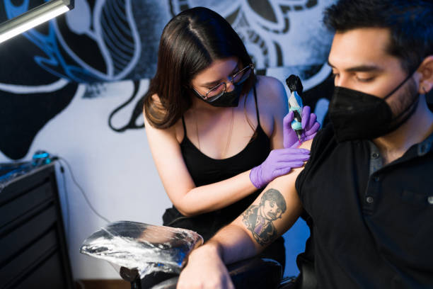 istock Skilled woman creating a tattoo 1346235274
