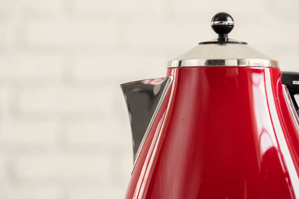 A clean 3D render of a beige electric kettle with water-level window, floating over a deep viva-magenta studio backdrop.