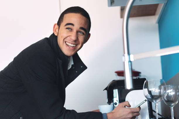 istock Happy young businessman taking a break for a cup of coffee 1346242082