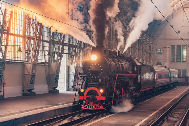 istock Retro steam train departs from the station. 1346246919