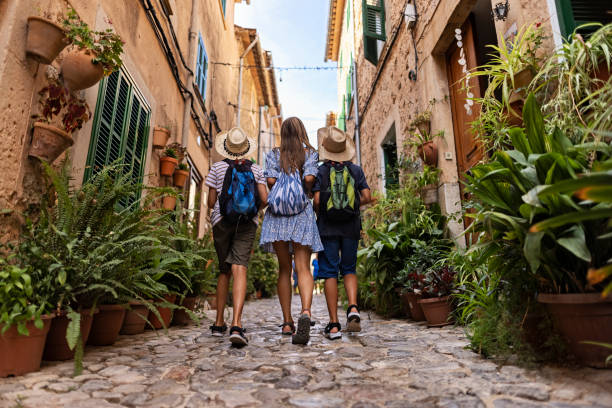 Multi generation family sightseeing beautiful town of Valldemossa, Majorca, Spain stock photo