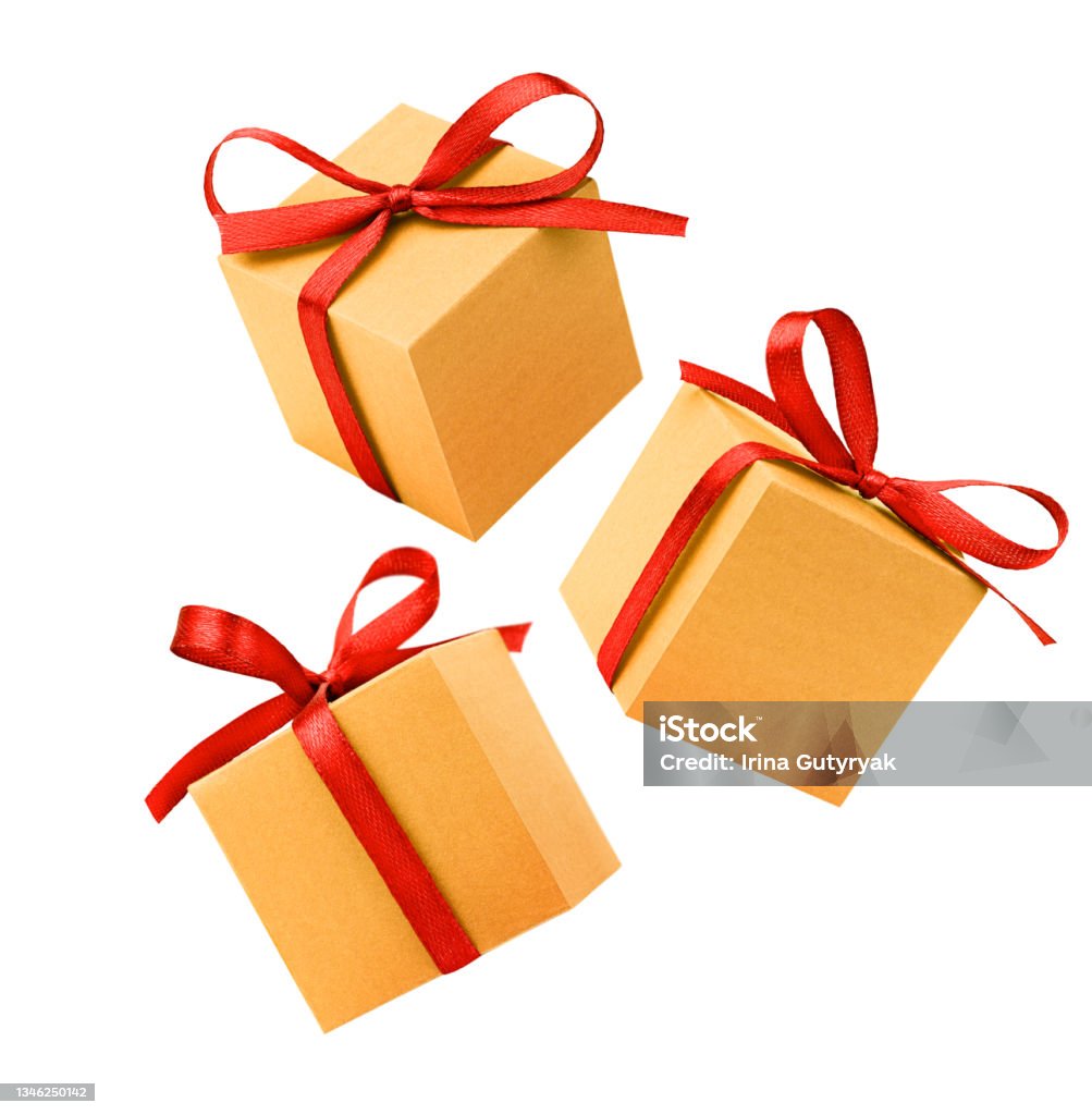 three gifts three gold gift boxes with red bow on isolated white background Gift Stock Photo