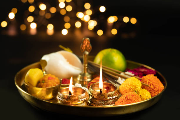 Golden Brass Pooja Ki Thali With Fruit, Marigold, Ghanti, Diya, Deep, Dia, Shankh, Phool, Peda, Laddu, Laddoo And Agarbatti. Used In Navratri, Dussehra Puja, Karva Chauth, Shubh Teej, Ganesh Chaturthi Golden Brass Pooja Ki Thali With Fruit, Marigold, Ghanti, Diya, Deep, Dia, Shankh, Phool, Peda, Laddu, Laddoo And Agarbatti. Used In Navratri, Dussehra Puja, Karva Chauth, Shubh Teej, Ganesh Chaturthi religious celebration stock pictures, royalty-free photos & images