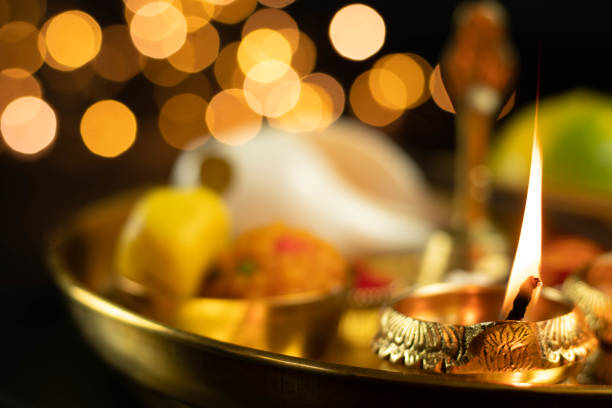istock Illuminated Metal Brass Lamp Called Diya Deep Or Dia Glowing With Bokeh. Theme For Diwali, Navratri, Dussehra Puja, New Year, Deepawali, Karva Chauth, Teej, Ganesh Chaturthi Or Shubh Deepavali Pooja 1346254719