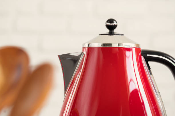 istock Vintage style red electrical teapot in kitchen interior 1346256072