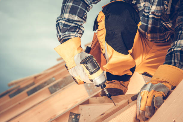 istock Wooden House Roof Skeleton Assembling by Worker 1346257725
