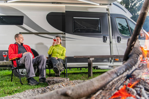 istock Couple Drinking Wine in Front of Their RV Camper Van 1346257872