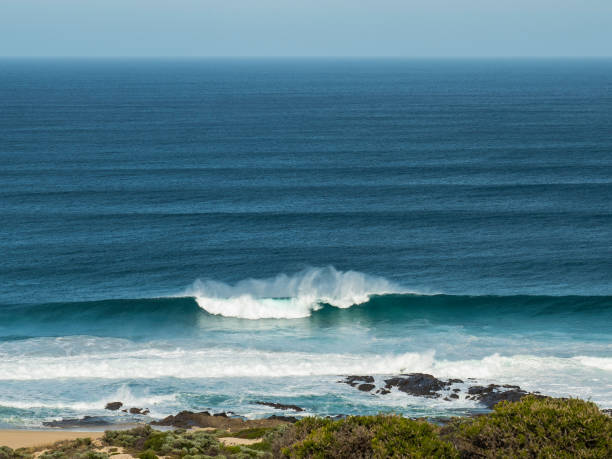 istock View of rolling ocean waves from a cliff 1346263966