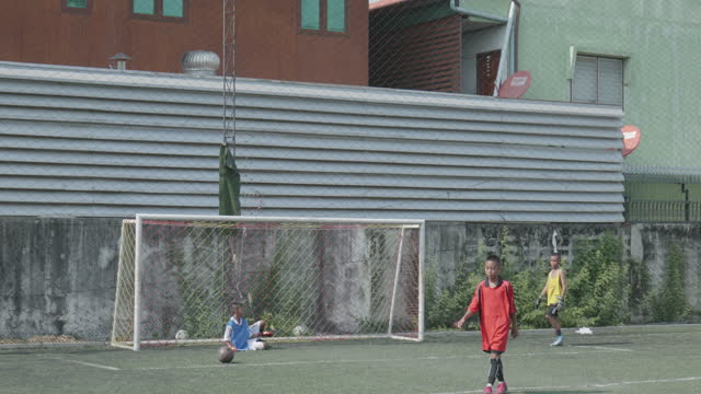 The goalkeeper prepares to defend.