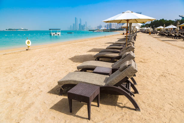 istock Sunbeds at the beach in Abu Dhabi 1346271210
