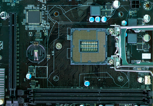 Complex Mainboard electronic circuits of computer. A powerful computer processor and a modern motherboard.