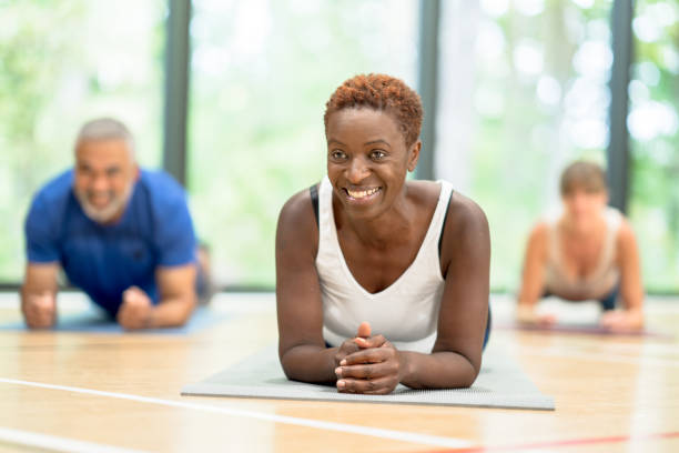 istock Holding a plank in yoga class 1346275775